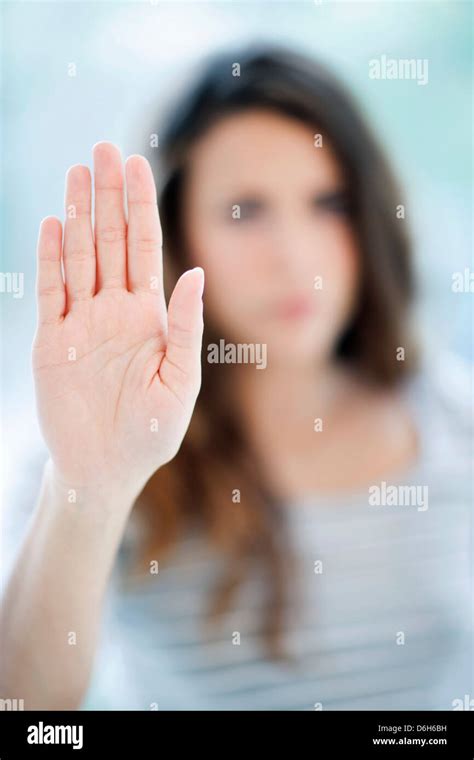Woman making stop sign Stock Photo - Alamy