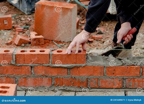 Bricklayer Laying Bricks on Mortar on Residential House Construction ...