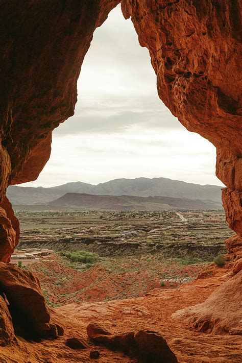 Desert Cave Entrance Overlooking The Suburbs Of St. George Utah Photograph by Cavan Images - Pixels