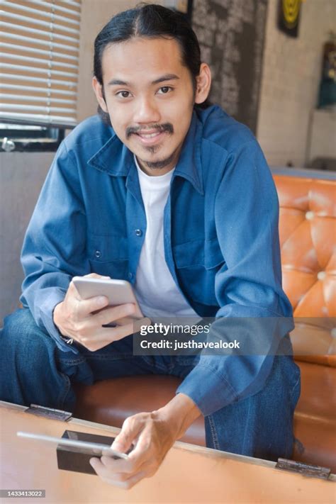 Young Thai Man In Qr Code Payment Scene In Coffee Shop High-Res Stock Photo - Getty Images