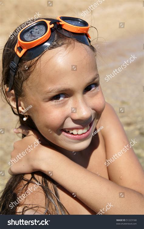 Preteen Girl In Swiming Outfit Enjoying Sun-Bath On Sea Beach Stock Photo 51223168 : Shutterstock