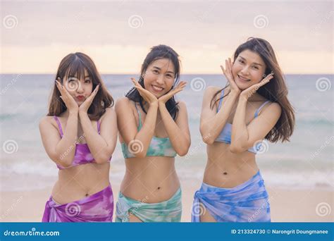 Three Young Women Friends Happily Wear this Bikini on a Beach in Nai Thon Beach, Phuket Province ...