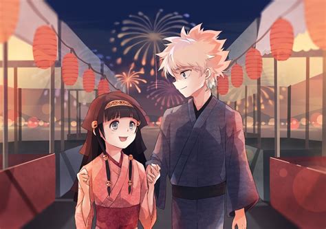 two anime characters standing next to each other in front of fireworks and buildings at night