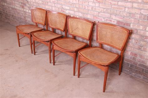 Finn Juhl for Baker Furniture Teak and Cane Dining Chairs, Set of Four For Sale at 1stDibs