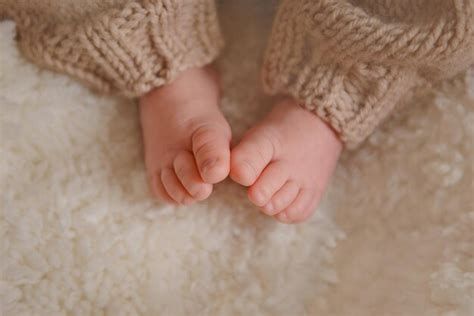 Premium Photo | Newborn baby feet photo of newborn baby feet soft focus