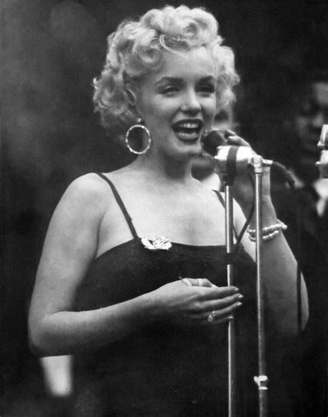 Marilyn Monroe sings in front of the US Army soldiers during the first show of her four-day tour ...