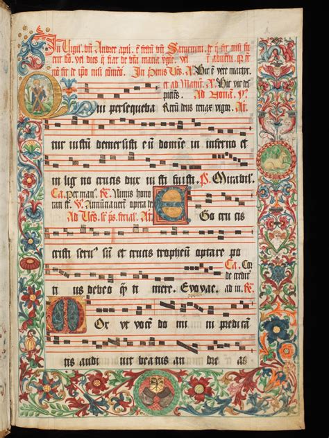 A richly decorated medieval music sheet. The border are made of a large variety of flowers ...