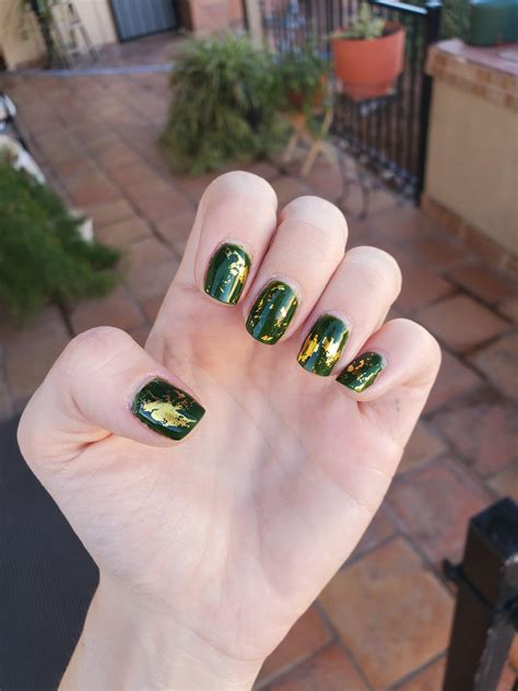 I forgot to take a picture of this green and gold nail art when I first did it. So I this ...