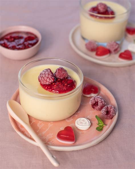 Lemon posset with raspberry coulis and frozen raspberries - Green Isle