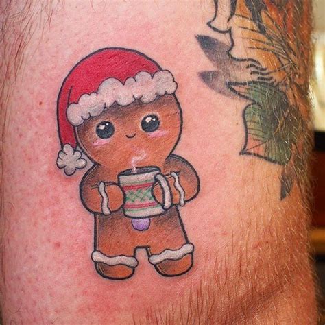 25 Christmas Tattoos That Spark Joy All Year Long | Christmas tattoo, Winter tattoo, Funny tattoos
