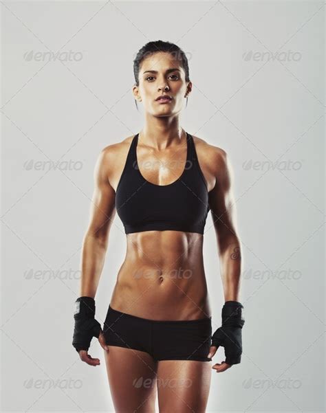 Tough young woman with muscular body Stock Photo by jacoblund | PhotoDune