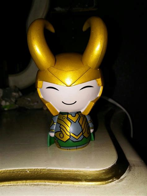 a toy with horns on it sitting on a counter