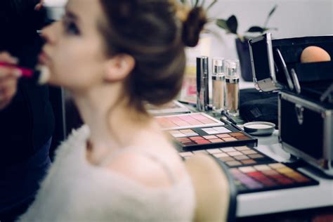 Woman Sitting Doing Makeup · Free Stock Photo