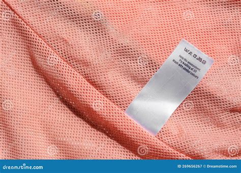 Clothing Label with Instruction on Pink Garment, Closeup. Space for Text Stock Image - Image of ...