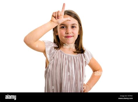 Portrait of happy girl making loser hand gesture at camera. Portrait of ...