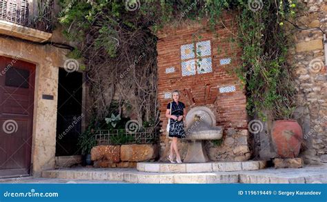 Woman at the Drinking Fountain Stock Image - Image of built, people: 119619449