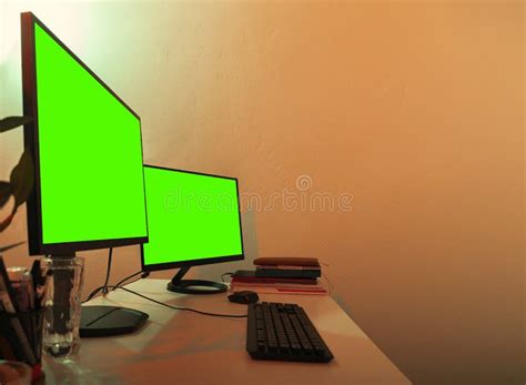 White Desk with Two Monitors on it Green Screens Turned on for Copy Space. Stock Photo - Image ...