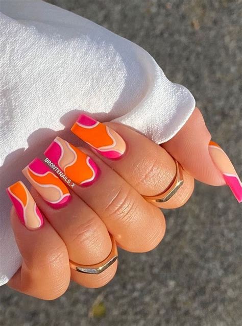 The Prettiest Summer Nail Designs We've Saved : Bright pink & orange swirl nails