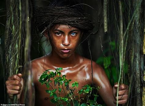 Indonesian tribe with extremely rare electric blue eyes photographed