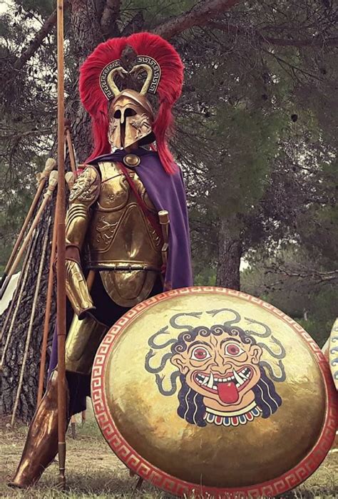 a man dressed in armor and holding a shield