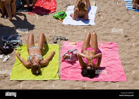 Sunbathers on the beach at Cannes, Cote d'Azur, France Stock Photo - Alamy