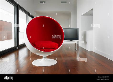 Spherical armchair on an empty luxury living room Stock Photo - Alamy