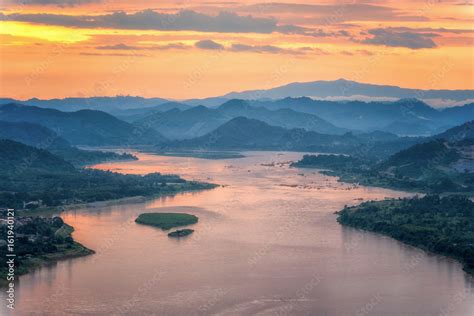 Sunset behind hill and Mekong river view at Nong Khai Stock Photo ...