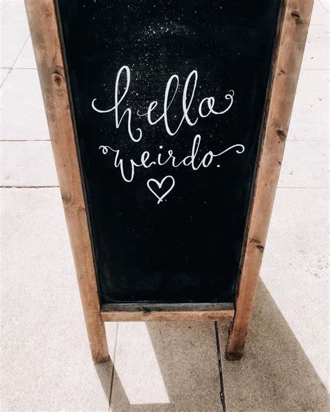 a chalkboard sign that says hello weirdo on it's side, with the words hello weirdo written in ...