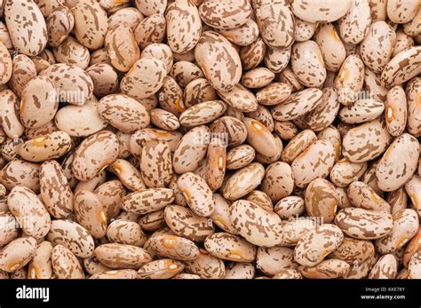 dry uncooked pinto beans close up background image Stock Photo - Alamy