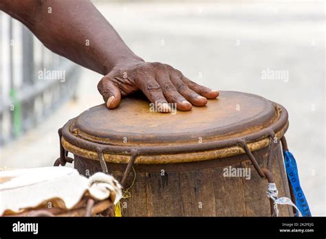 Percussionist playing a rudimentary atabaque during afro-brazilian capoeira fight Stock Photo ...