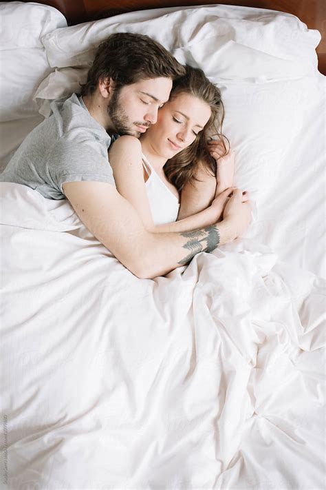 "Couple Sleeping Hugging On Pillow" by Stocksy Contributor "Studio ...