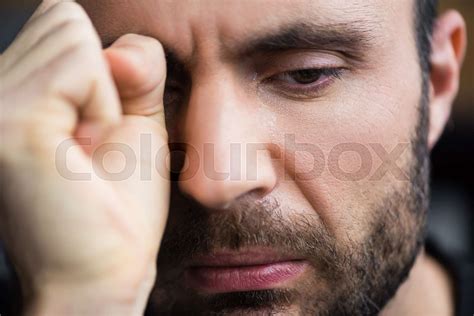 portrait of handsome crying man wiping tears away with hand | Stock ...