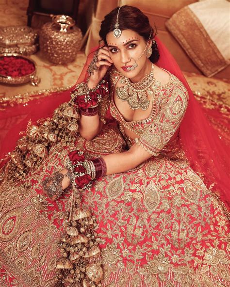 Kriti Sanon in a gorgeous red bridal lehenga in Manish malhotra outfit ...