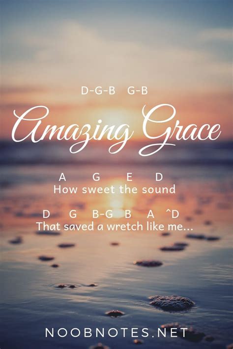 the words amazing grace written in front of an ocean scene with rocks and sand at sunset