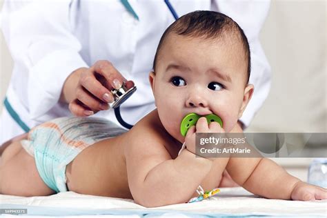 Doctor Checking Baby With Stethoscope High-Res Stock Photo - Getty Images