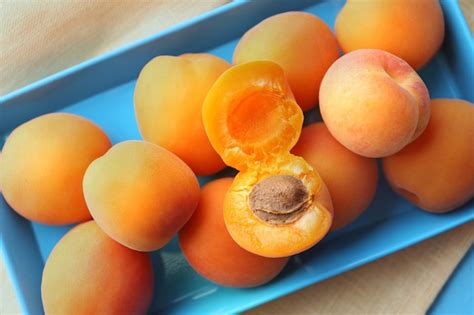 Premium Photo | Ripe apricots on metal tray on table close up