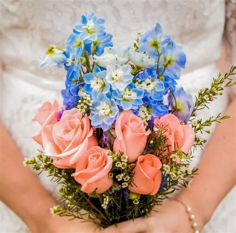 Blue & orange bouquet | Orange bouquets, Wedding flowers, Pink bouquet