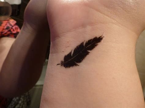 57 Attractive Wrist Feather Tattoos