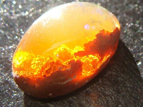 A real life fire stone ( x-post from r/pics)( it is called a fire opal ...