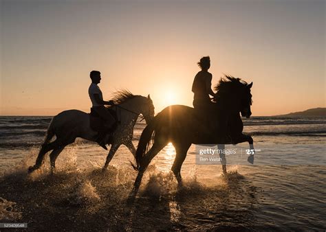 People horse riding along the beach. Tarifa, Cadiz, Costa de la Luz ...