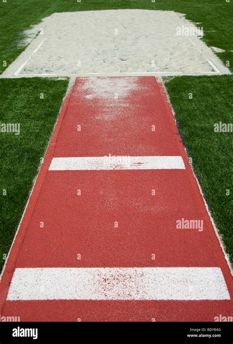 Jump athletics sand hi-res stock photography and images - Alamy