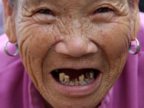 Photo: A Very Smiling (and Toothless) Old Chinese Lady