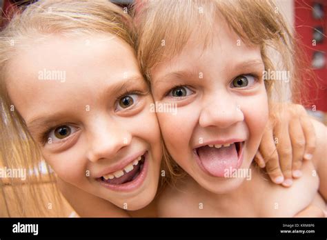 Close-up portrait of two girls five and seven years Stock Photo - Alamy