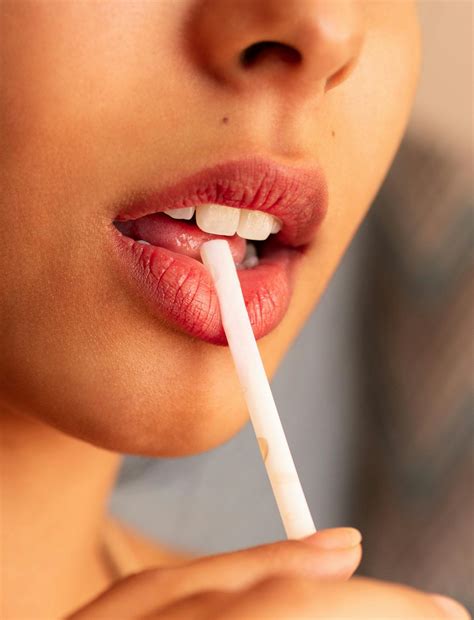 Woman With Red Lipstick With Straw Between Lips · Free Stock Photo