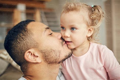 Dad Kissing Little Daughter - Stock Photos | Motion Array