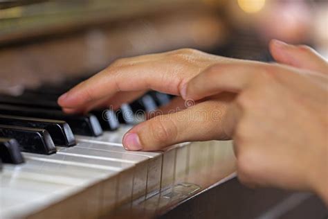 Correct the Left Hand with the Right Hand while Playing the Piano, Horizontal Stock Photo ...