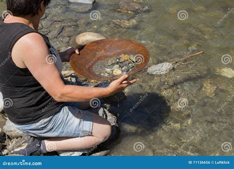 Gold Nugget Mining from the River Stock Photo - Image of goldpanning, equipment: 71136656