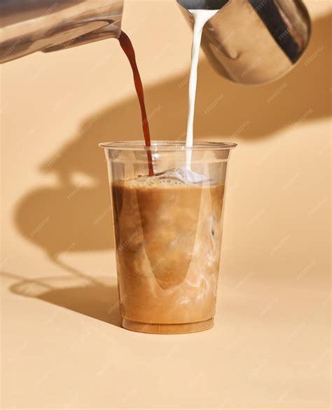 Premium Photo | Mockup of iced coffee milk in a plastic cup inside a cafe