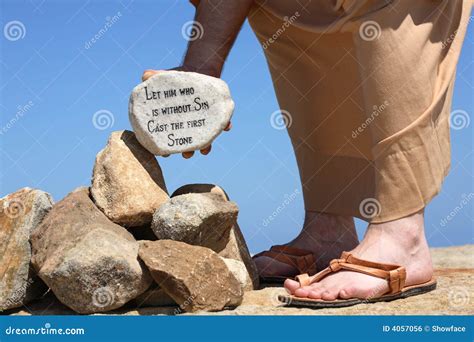 Man Holding Rock With Bible Verse John 8:7 Stock Photo | CartoonDealer.com #4057056