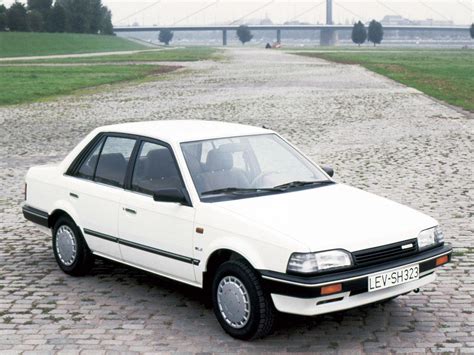 White Car Parked on Cobblestone Road